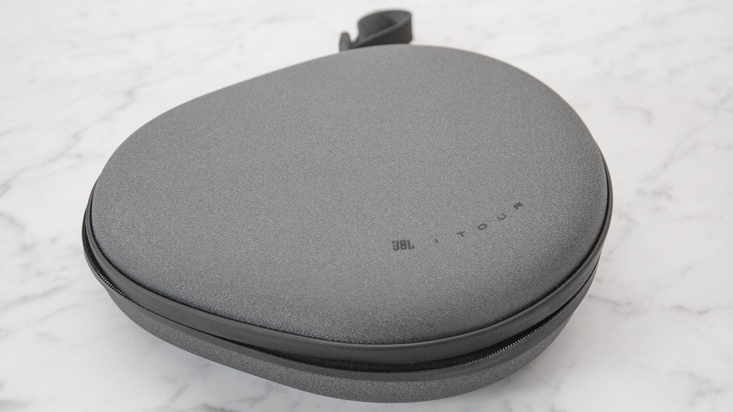 JBL Tour ONE M3 carrying case, showing logo