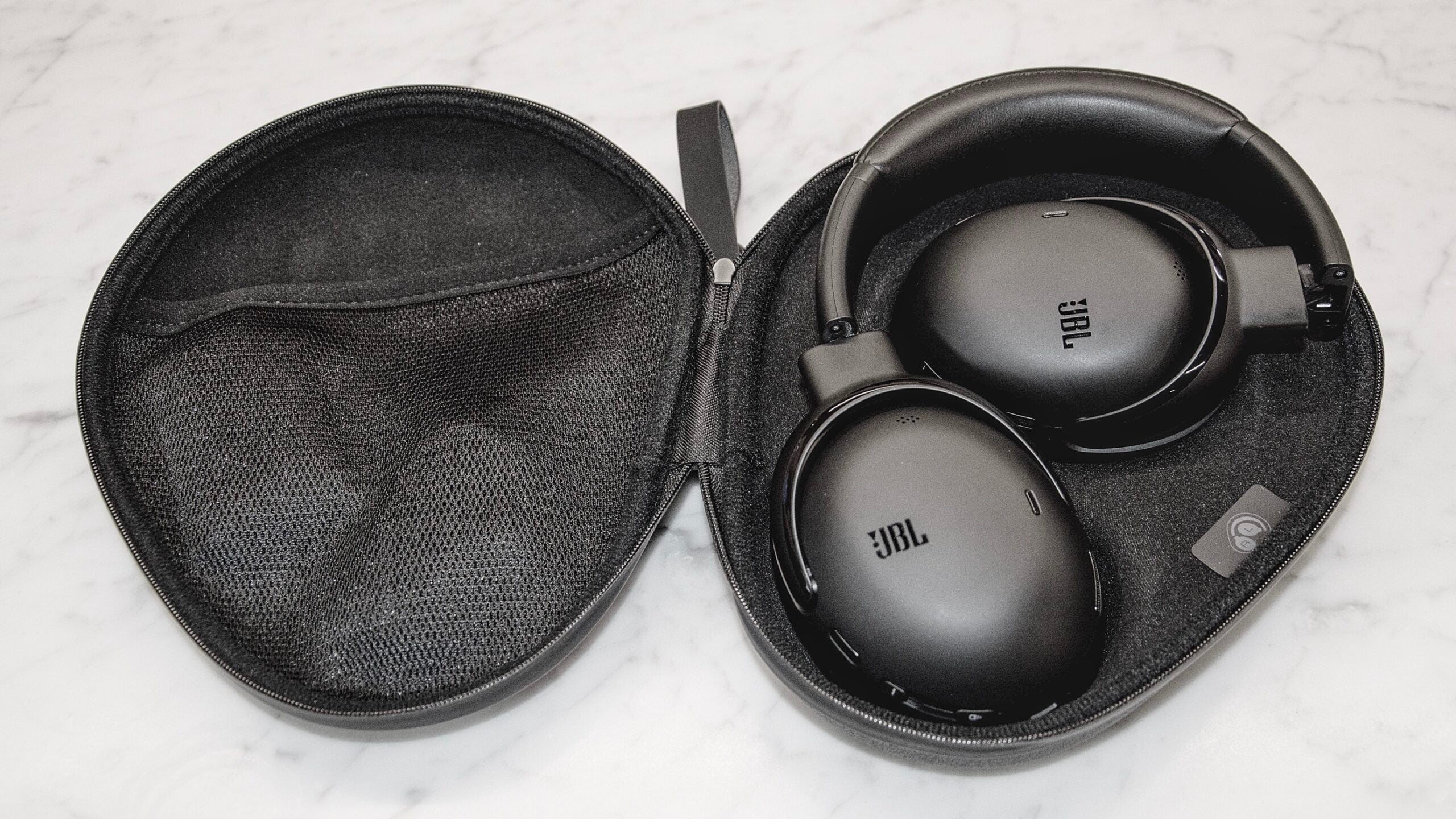 The JBL Tour ONE M3 packed away inside its case