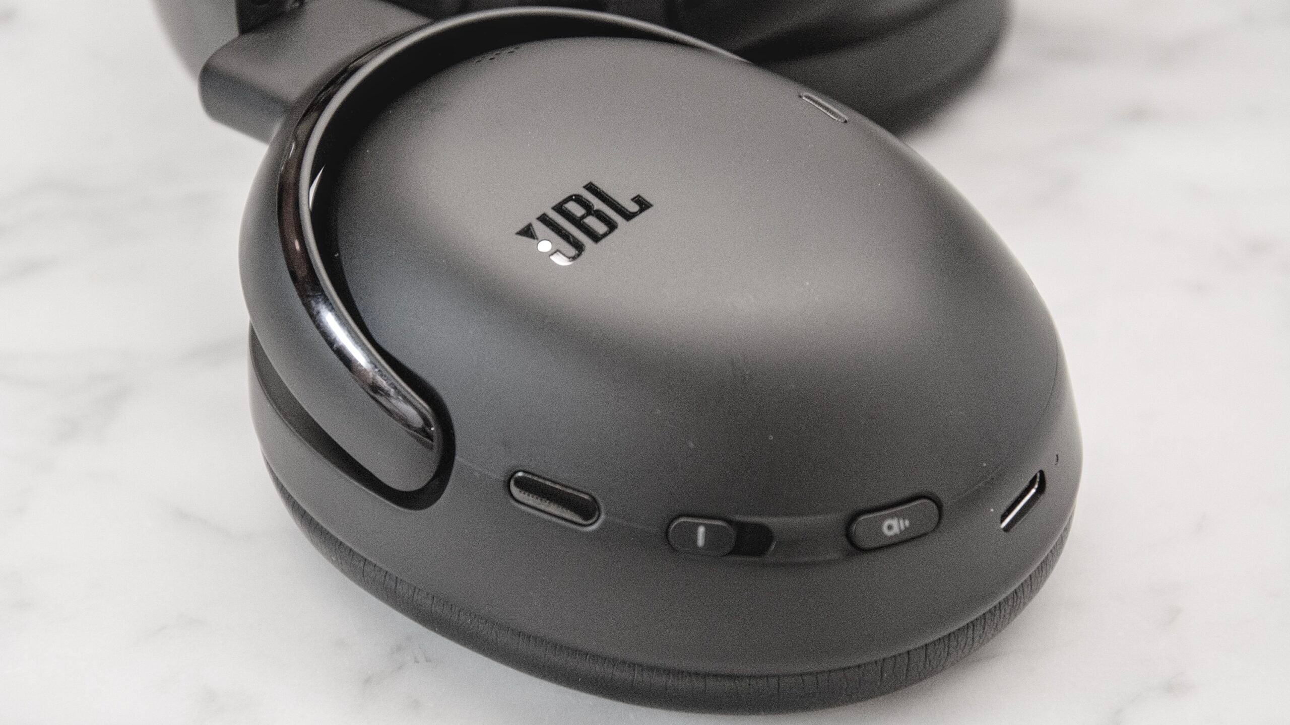 A close up of the outside of the JBL Tour ONE M3's right earcup